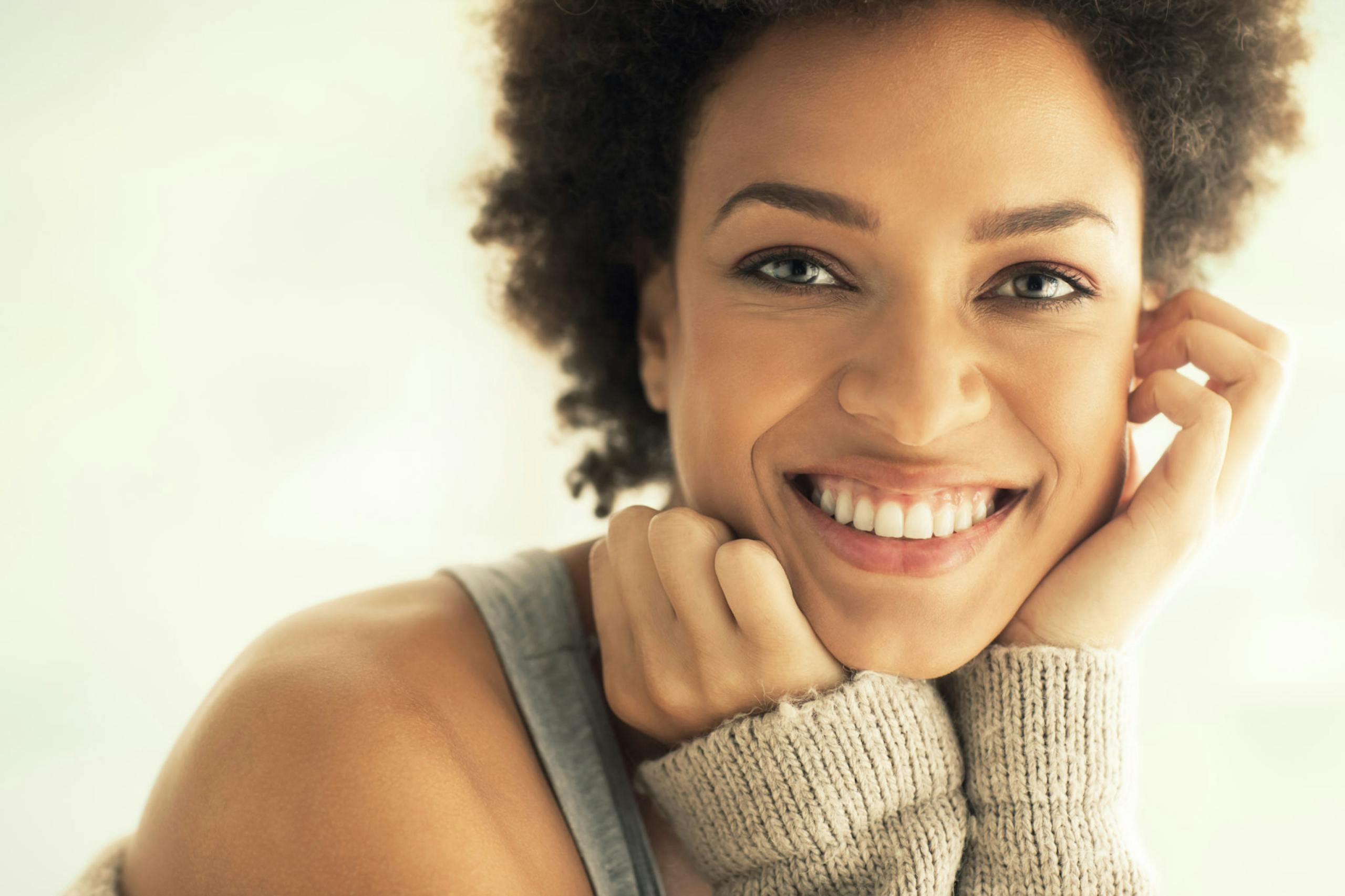 Captivating portrait of a smiling woman with a warm and friendly expression.