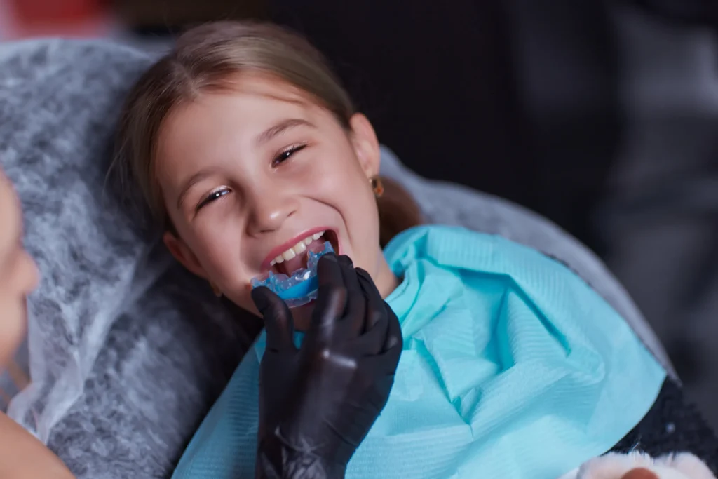Girl being fitted for a sports mouth guard