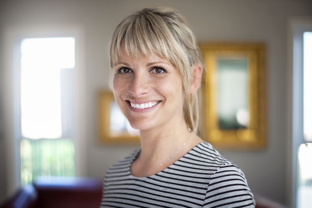 Smiling woman at home