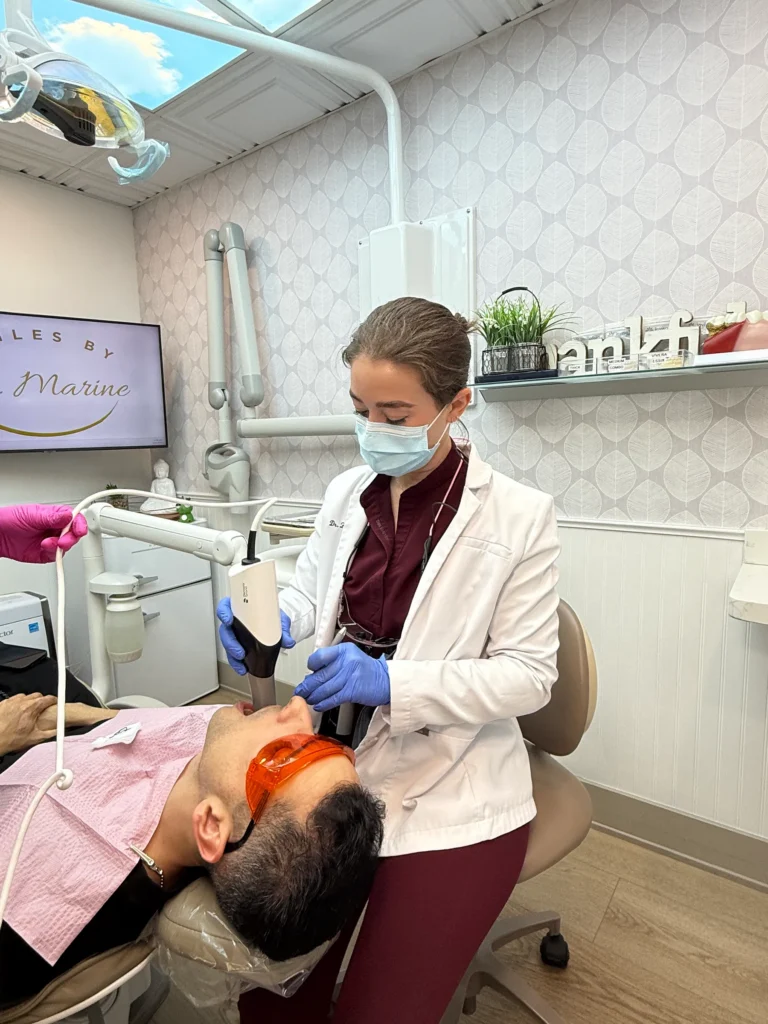 A clinician treating a patient in a Pacific Dental Care operatory